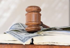 iStock-612401378-gavel-money-300x206