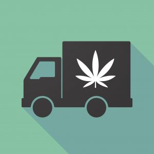 Silhouette of black truck with white marijuana leaf on it